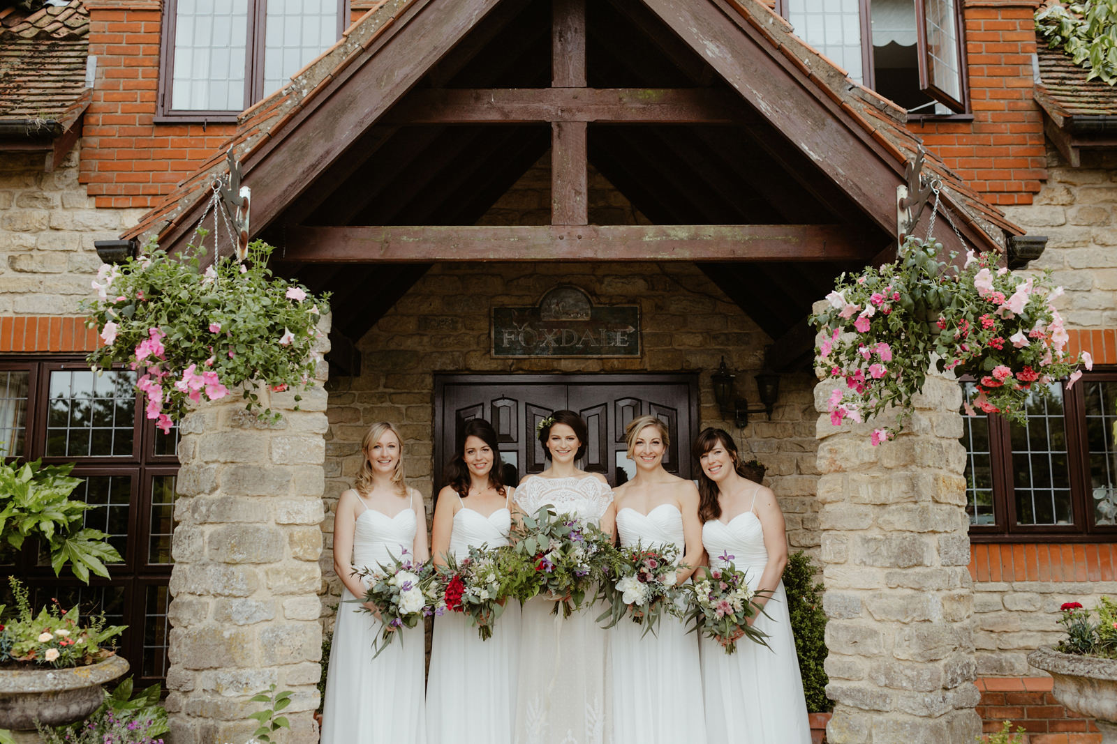 bride and bridesmaid wedding in the british countryside