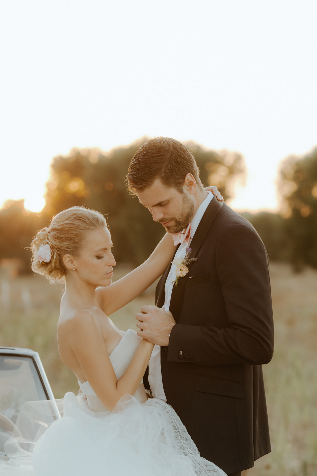 bride and groom at sunset